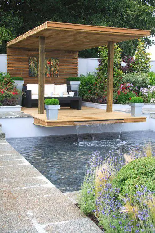 Get the perfect custom pergola shade for your delight. Find the pergola pool designs that suit the space you want to create! Go to backyardmastery.com for more ideas.