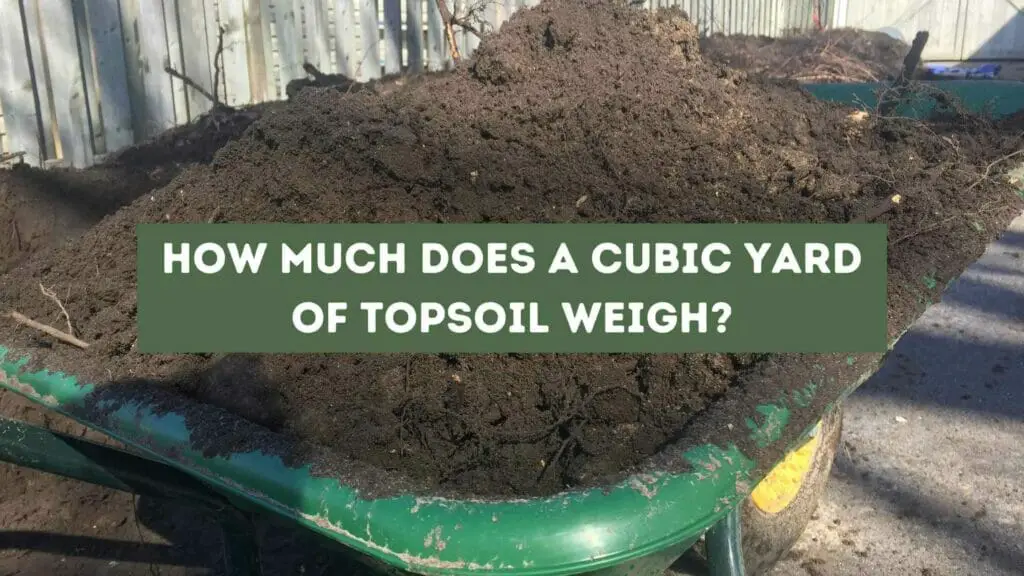 Photo of a green wheelbarrow full of topsoil. How Much Does a Cubic Yard of Topsoil Weigh?