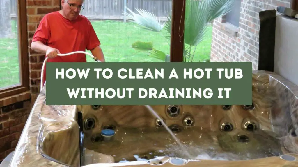 Man in a red shirt filling a hot tub with water. How to Clean a Hot Tub Without Draining It